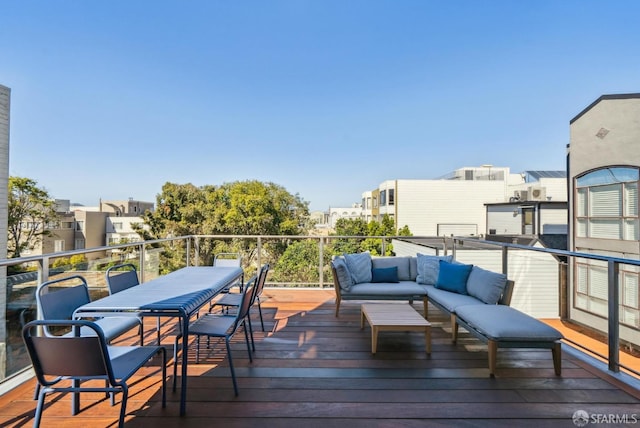 wooden deck featuring outdoor lounge area