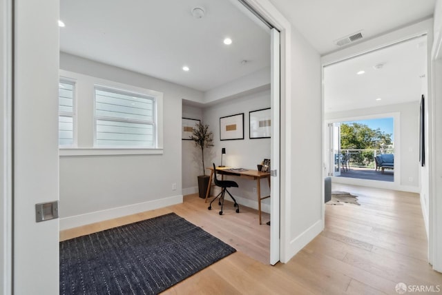 office with recessed lighting, visible vents, baseboards, and wood finished floors