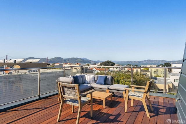 deck featuring a mountain view and outdoor lounge area