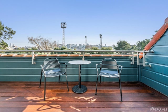 wooden deck featuring a view of city