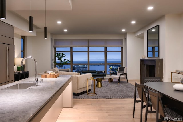 living area with recessed lighting and light wood-type flooring