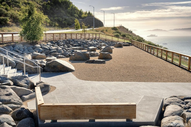 view of patio featuring a water view