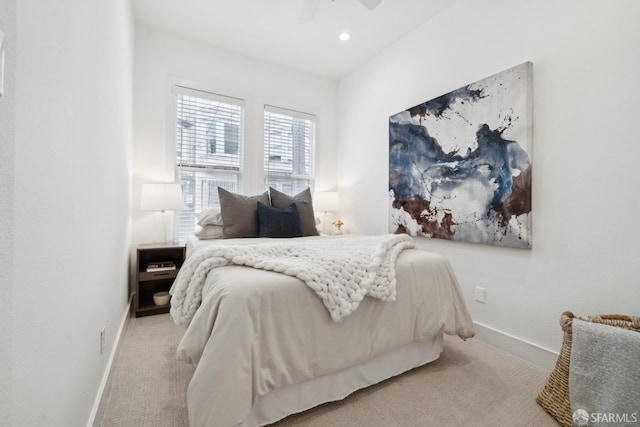 carpeted bedroom with ceiling fan, baseboards, and recessed lighting