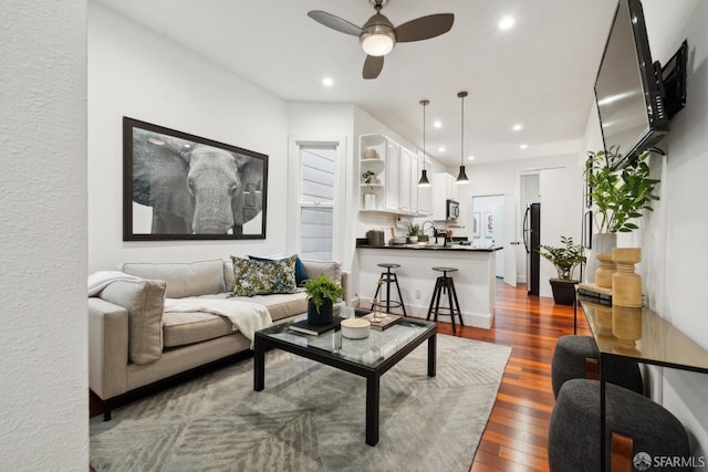 living area with dark wood-style floors, recessed lighting, and a ceiling fan