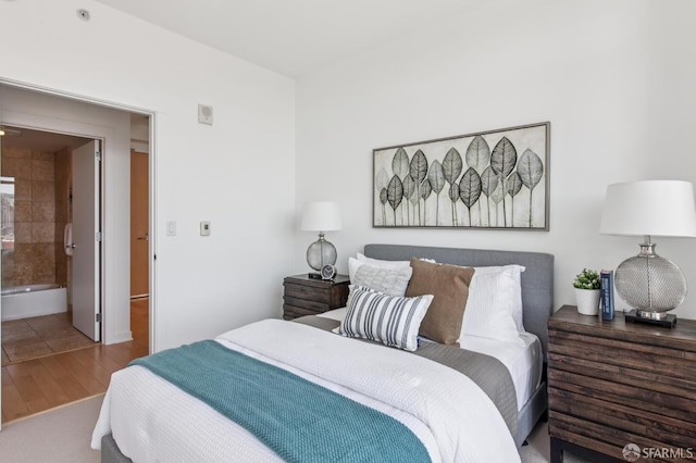 1160 Mission St Unit 2212, San Francisco, CA 94103 - bedroom featuring wood finished floors and ensuite bath