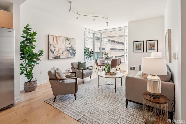 1160 Mission St Unit 2212, San Francisco, CA 94103 - living room with light wood finished floors and track lighting