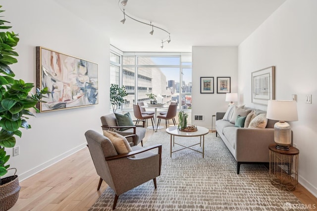 1160 Mission St Unit 2212, San Francisco, CA 94103 - living room with wood finished floors, track lighting, and a view of city