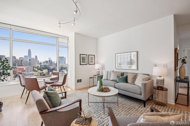 1160 Mission St Unit 2212, San Francisco, CA 94103 - living area with wood finished floors and a view of skyline