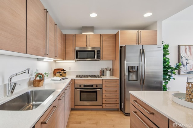 1160 Mission St Unit 2212, San Francisco, CA 94103 - kitchen featuring stainless steel appliances, light wood-type flooring, light countertops, recessed lighting, and brown cabinetry