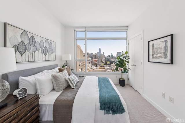 1160 Mission St Unit 2212, San Francisco, CA 94103 - bedroom with a view of skyline and carpet flooring