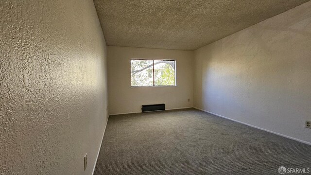 2011 Market Ave Unit 324, San Pablo, CA 94806 - carpeted empty room with a textured wall and a textured ceiling