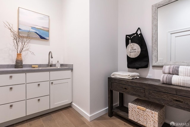 bathroom featuring vanity and hardwood / wood-style flooring