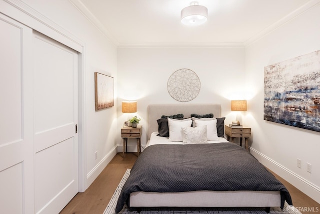 bedroom featuring a closet and crown molding