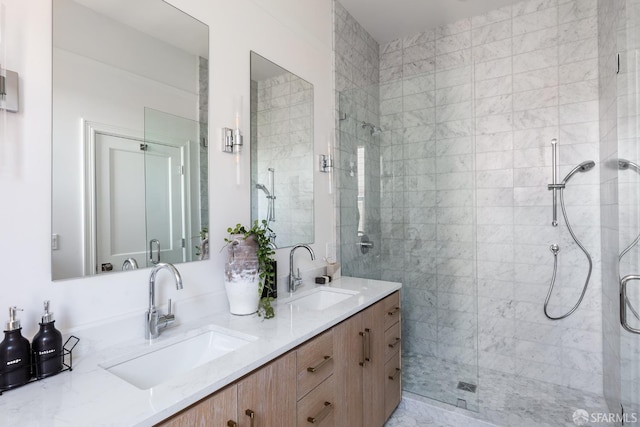 bathroom featuring vanity and a shower with door