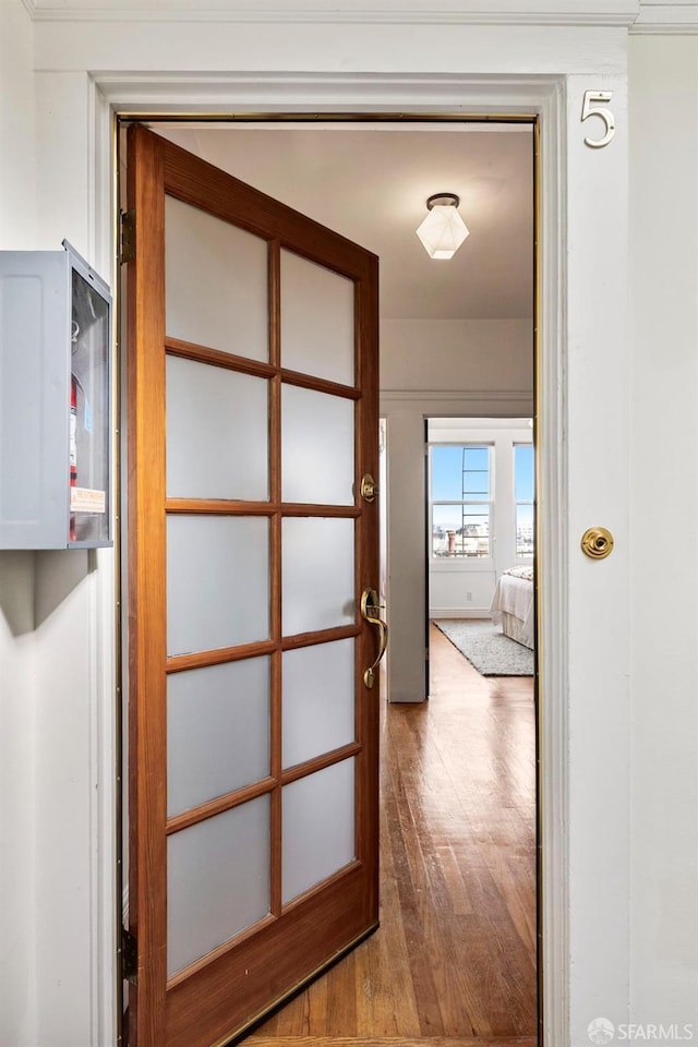 corridor featuring wood finished floors