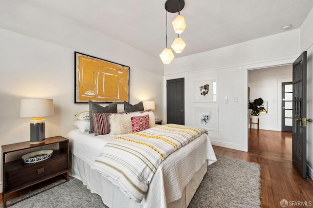 bedroom with wood finished floors