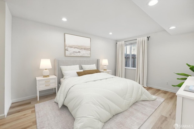 bedroom with recessed lighting and light wood-type flooring