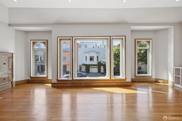 foyer entrance featuring recessed lighting, baseboards, and wood finished floors