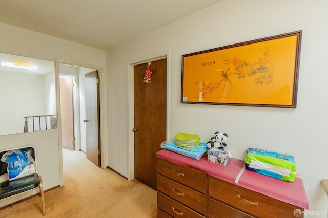 corridor featuring light colored carpet