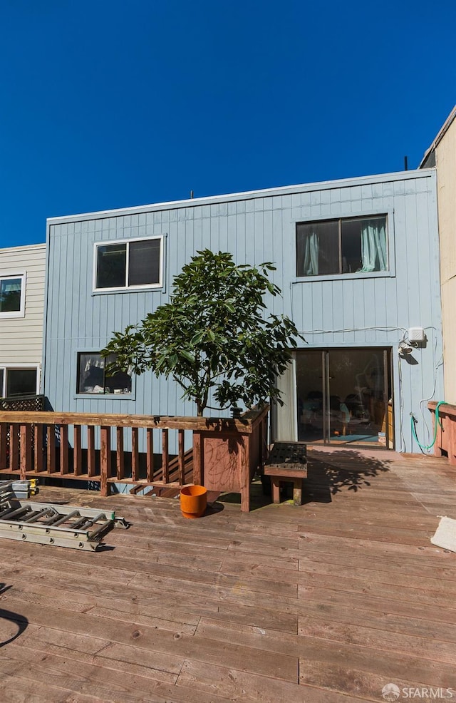 view of front facade with a wooden deck