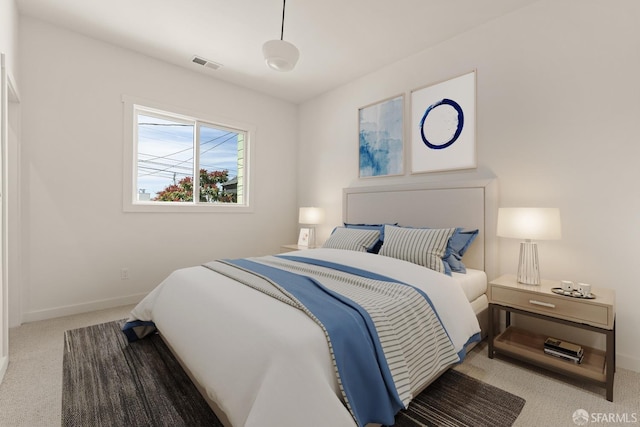 bedroom featuring carpet floors, visible vents, and baseboards