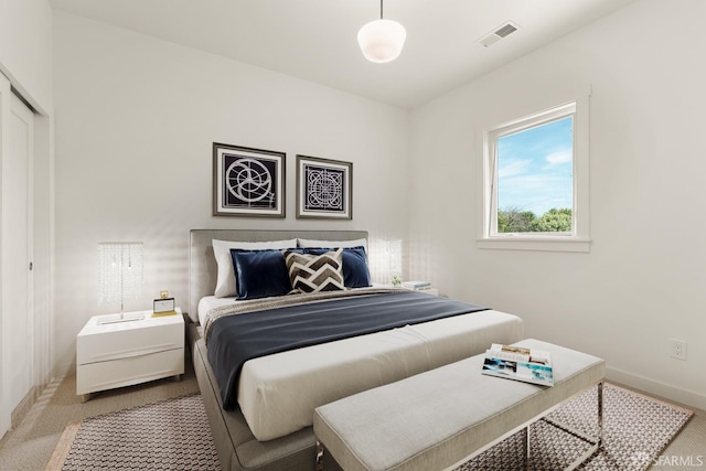 bedroom featuring carpet, visible vents, and baseboards