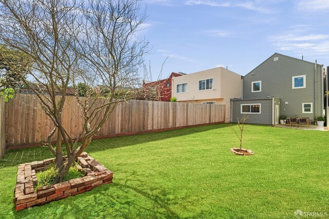 view of yard with a patio area and a fenced backyard