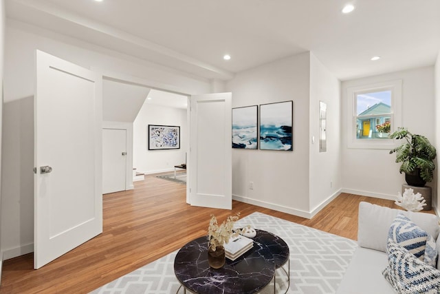 interior space featuring light wood finished floors, baseboards, and recessed lighting