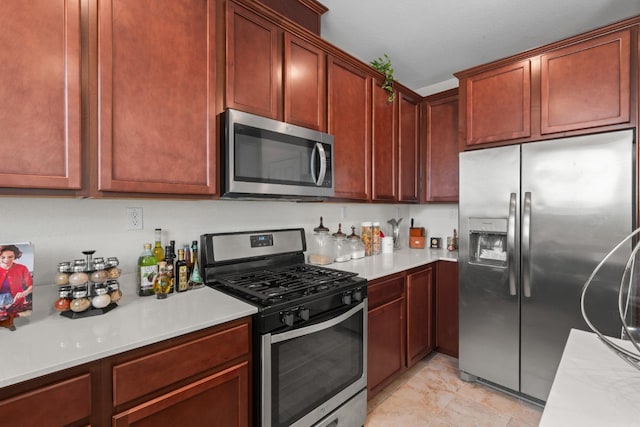 kitchen with stainless steel appliances and light countertops
