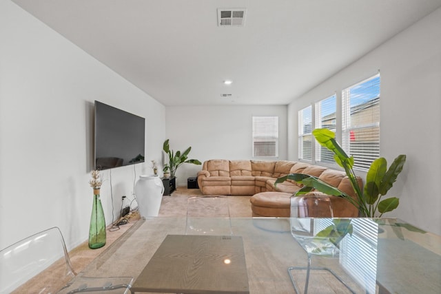 carpeted living area with visible vents