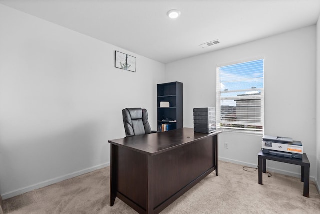 office with light carpet, baseboards, and visible vents