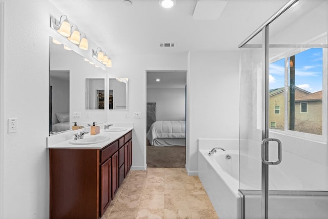 ensuite bathroom with double vanity, visible vents, a sink, and ensuite bathroom