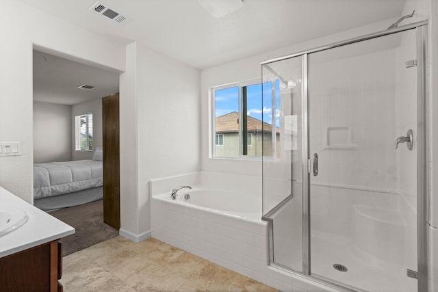 ensuite bathroom with visible vents, ensuite bathroom, a stall shower, vanity, and a bath