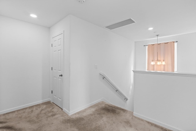stairway featuring carpet, visible vents, baseboards, and recessed lighting