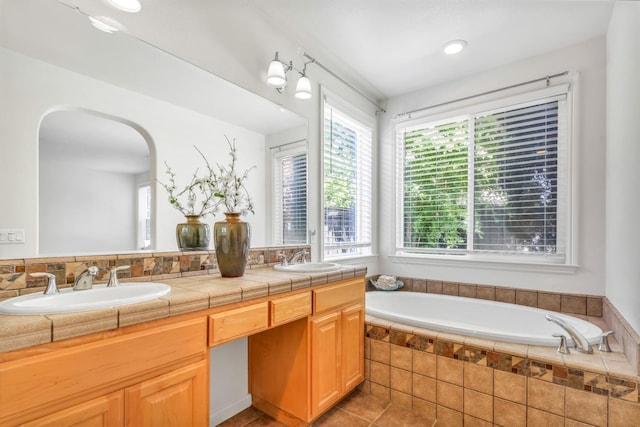 549 Fresian Dr, Oakdale, CA 95361 - full bath with a garden tub, double vanity, and tile patterned flooring