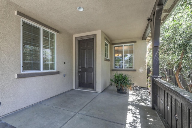 549 Fresian Dr, Oakdale, CA 95361 - view of exterior entry featuring stucco siding and a patio