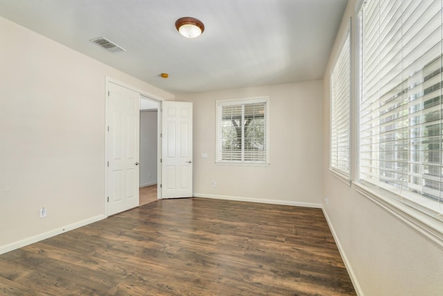 549 Fresian Dr, Oakdale, CA 95361 - unfurnished room featuring dark wood-style flooring and baseboards