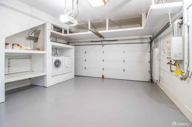 garage with a garage door opener, washing machine and dryer, and water heater