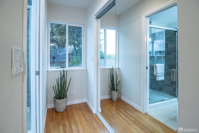 interior space featuring light wood-style floors and baseboards