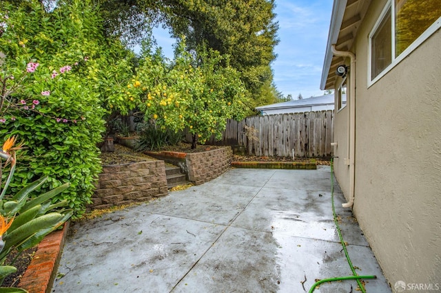 view of patio with fence