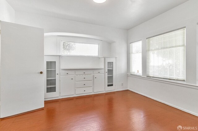 unfurnished living room featuring hardwood / wood-style floors