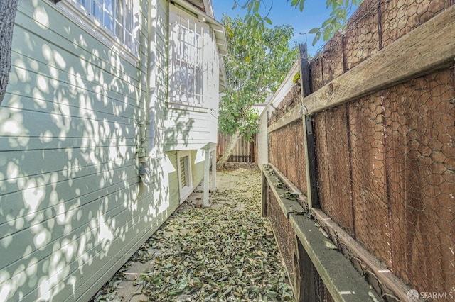 view of property exterior featuring fence