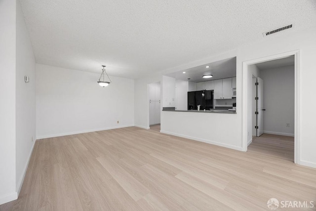 521 Ridgeview Ct, Pleasant Hill, CA 94523 - unfurnished living room featuring light wood finished floors, a textured ceiling, and baseboards