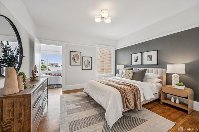 1371 16th Ave Unit 1373, San Francisco, CA 94122 - bedroom with baseboards and wood finished floors