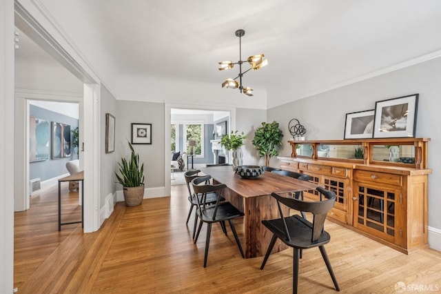 1371 16th Ave Unit 1373, San Francisco, CA 94122 - dining room featuring a chandelier and light wood-style floors