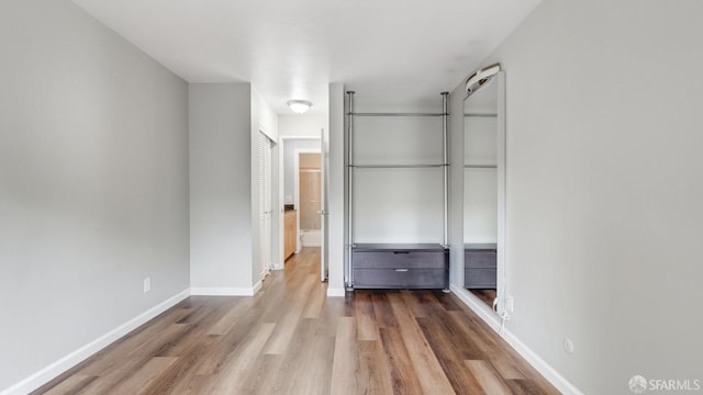 unfurnished bedroom with wood-type flooring