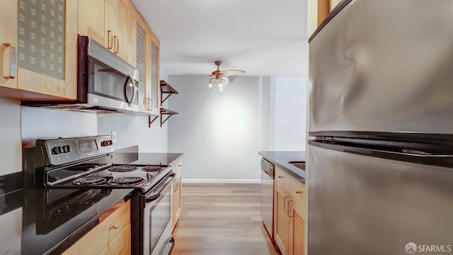 kitchen featuring light hardwood / wood-style flooring, stainless steel appliances, ceiling fan, and light brown cabinets