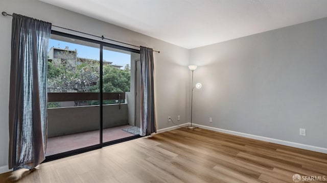 unfurnished room featuring wood-type flooring