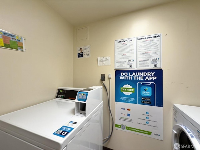 laundry area featuring washing machine and clothes dryer