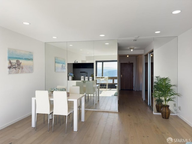 dining space with light wood-type flooring